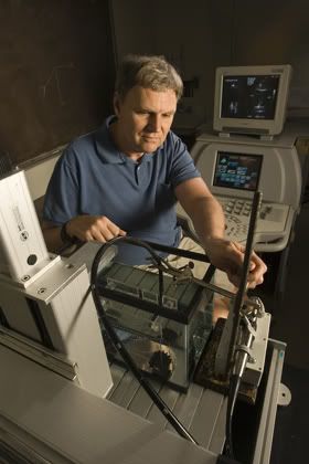 Pratt engineering professor Stephen Smith works with the novel robot surgeon.